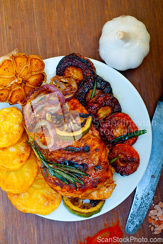 Image of roasted grilled BBQ chicken breast with herbs and spices