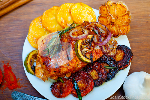 Image of roasted grilled BBQ chicken breast with herbs and spices