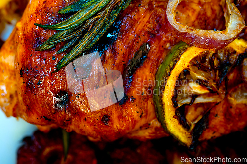 Image of roasted grilled BBQ chicken breast with herbs and spices