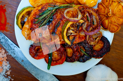 Image of roasted grilled BBQ chicken breast with herbs and spices