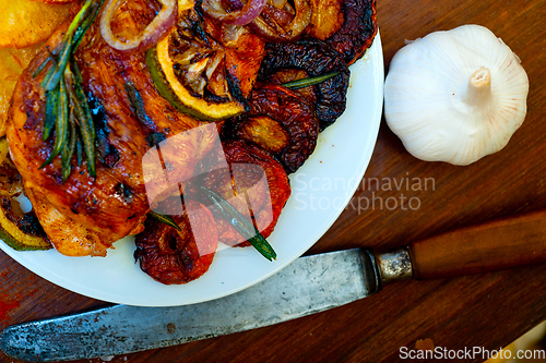 Image of roasted grilled BBQ chicken breast with herbs and spices