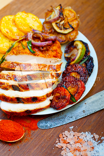 Image of roasted grilled BBQ chicken breast with herbs and spices