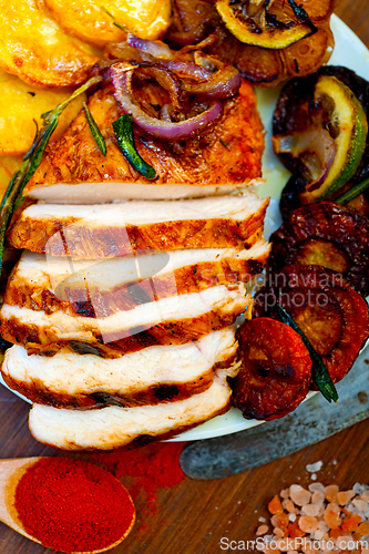 Image of roasted grilled BBQ chicken breast with herbs and spices