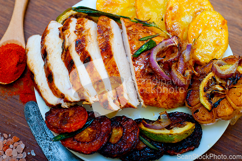 Image of roasted grilled BBQ chicken breast with herbs and spices