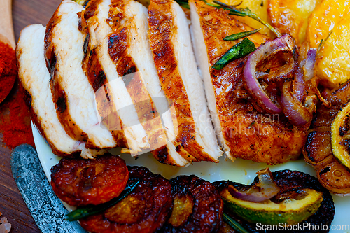 Image of roasted grilled BBQ chicken breast with herbs and spices
