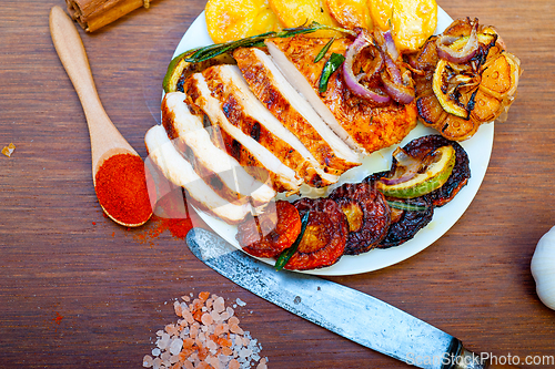 Image of roasted grilled BBQ chicken breast with herbs and spices