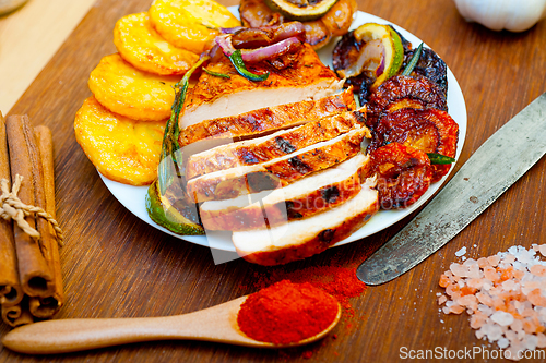 Image of roasted grilled BBQ chicken breast with herbs and spices