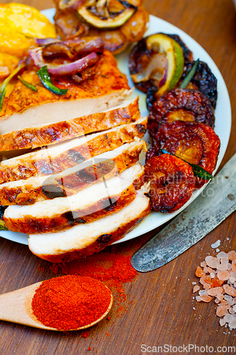 Image of roasted grilled BBQ chicken breast with herbs and spices