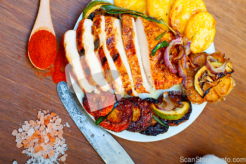 Image of roasted grilled BBQ chicken breast with herbs and spices