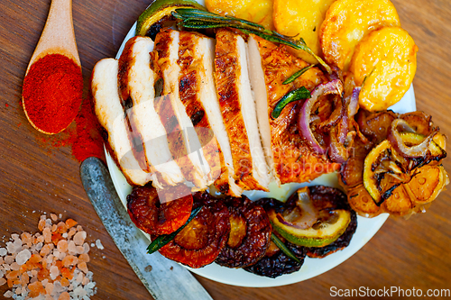 Image of roasted grilled BBQ chicken breast with herbs and spices