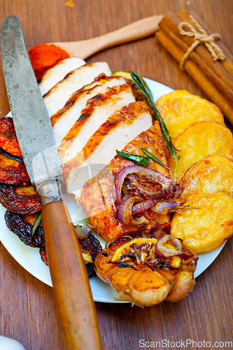 Image of roasted grilled BBQ chicken breast with herbs and spices