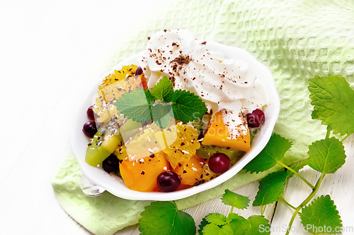 Image of Salad fruit with cranberries in bowl on napkin