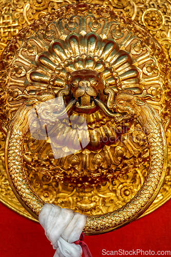 Image of Lion shaped door handle in Buddhist temple