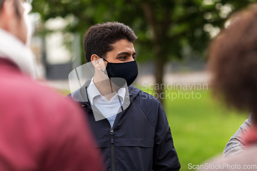 Image of indian man in reusable mask at park