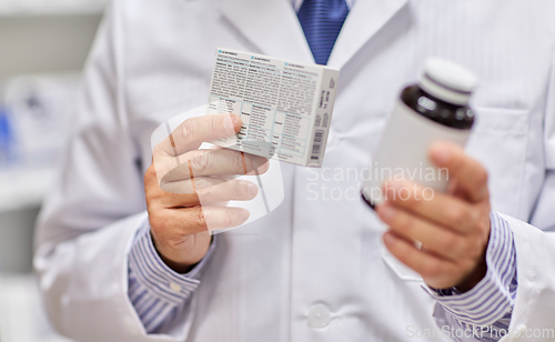 Image of close up of pharmacist with medicine at pharmacy