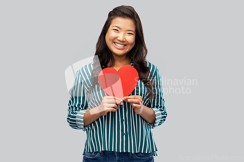 Image of happy asian woman with red heart