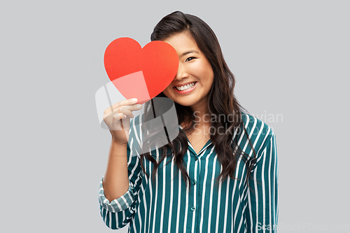 Image of happy asian woman with red heart