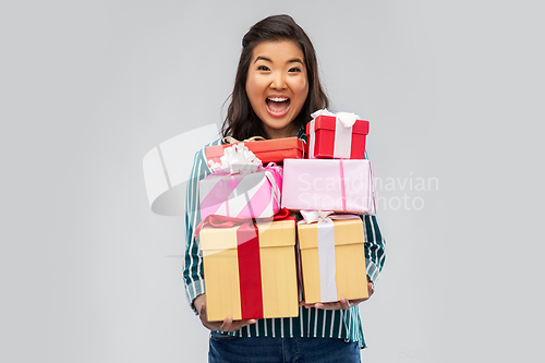 Image of happy asian woman with birthday present