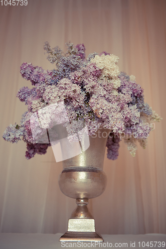 Image of Lilac bouquet in a silver vase