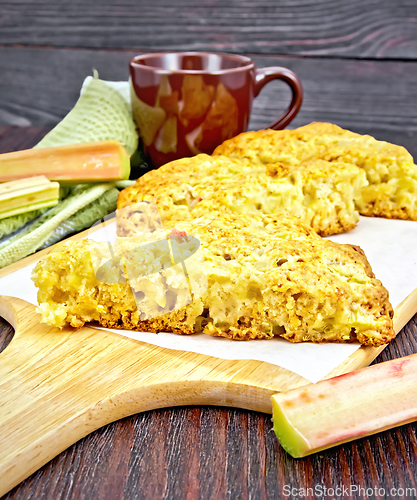 Image of Scones with rhubarb on dark wooden board