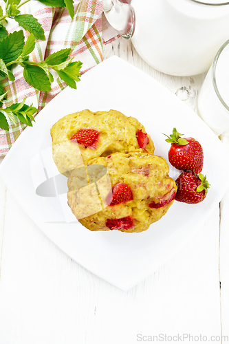 Image of Scones with strawberry in plate on light board top