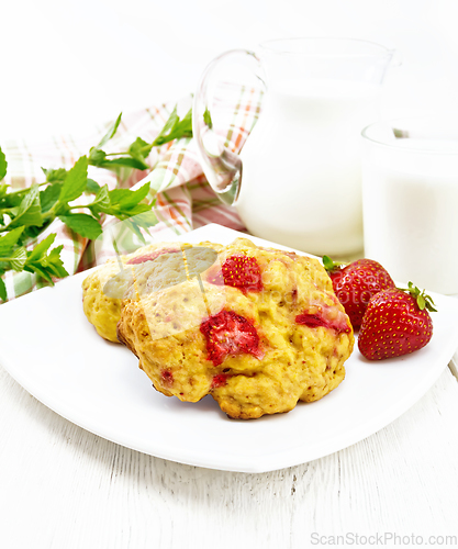 Image of Scones with strawberry in plate on light board