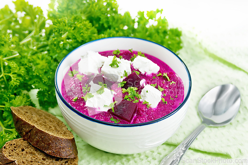 Image of Soup puree of beetroot with feta in bowl on board