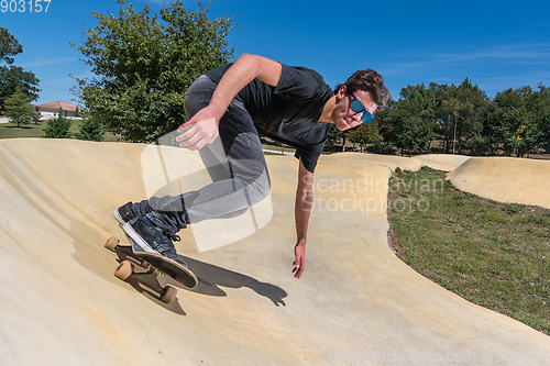 Image of Skateboarder on a pump track park
