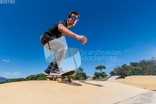Image of Skateboarder on a pump track park