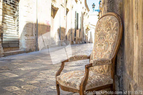 Image of Old chair in a traditional street of Lecce, Italy.