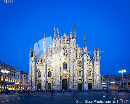 Image of MILAN, ITALY - APRIL 28th, 2018: turists during blue hour taking