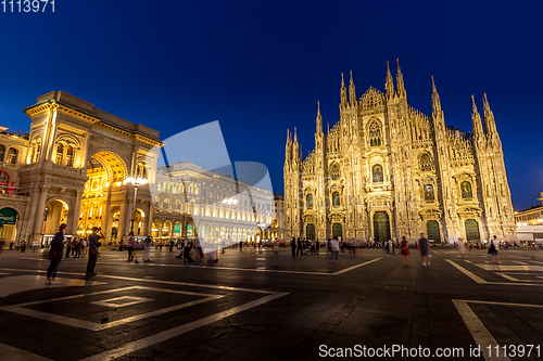 Image of MILAN, ITALY - APRIL 28th, 2018: turists during blue hour taking