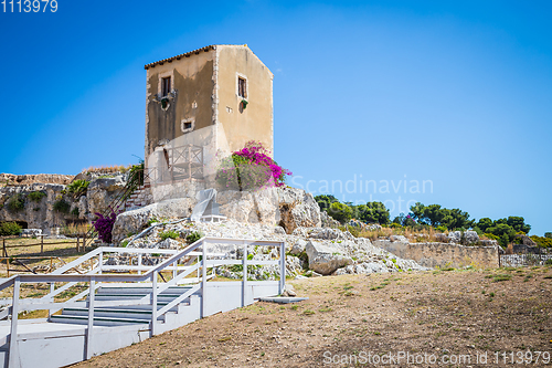 Image of Sicily, Italy. Old house with purple flowers in Syracuse.