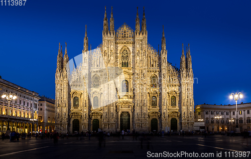 Image of MILAN, ITALY - APRIL 28th, 2018: turists during blue hour taking