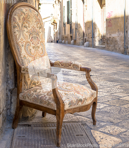 Image of Old chair in a traditional street of Lecce, Italy.