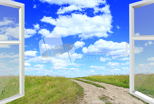 Image of opened window to the summer field