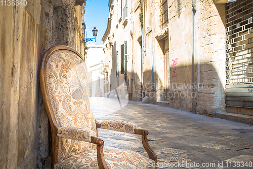 Image of Old chair in a traditional street of Lecce, Italy.