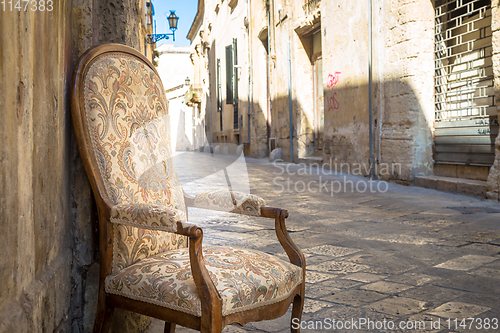 Image of Old chair in a traditional street of Lecce, Italy.