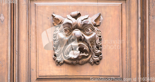 Image of Italy - Mask on an old door