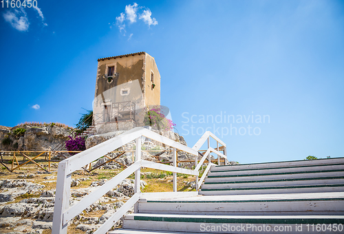 Image of Sicily, Italy. Old house with purple flowers in Syracuse.