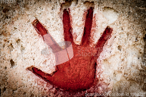 Image of Red hand on stone - graphic gothic element