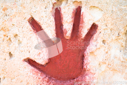 Image of Red hand on stone - graphic gothic element