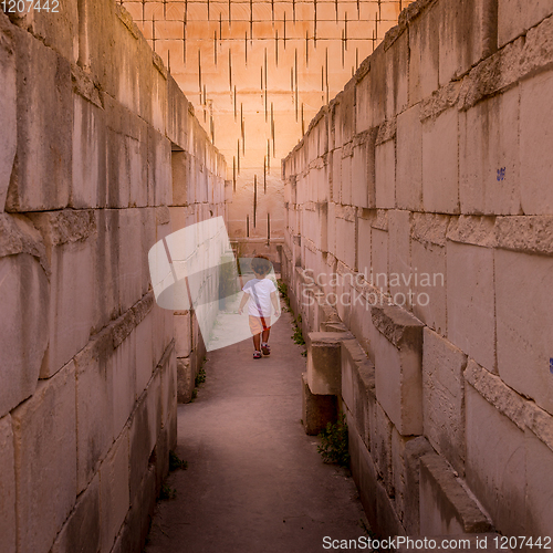 Image of Lonely young boy walking in a corridor