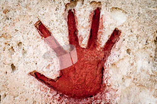 Image of Red hand on stone - graphic gothic element