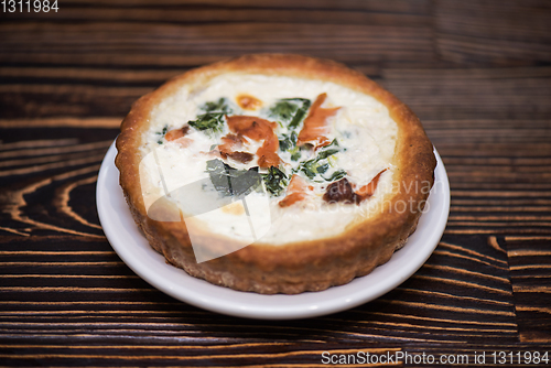 Image of Salmon pie on wooden