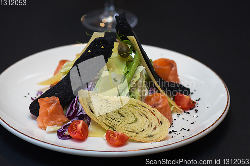 Image of Caesar salad with salmon fish