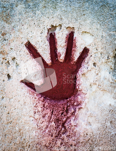 Image of Red hand on stone - graphic gothic element