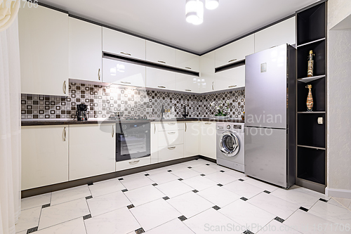 Image of Brown and white modern kitchen interior