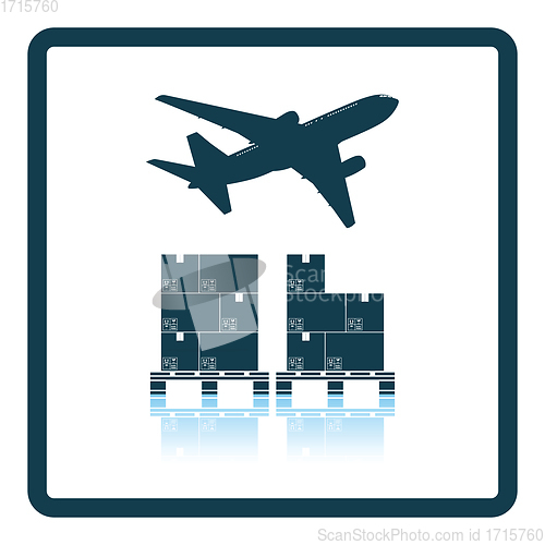 Image of Boxes on pallet under airplane