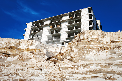 Image of Construction of the building on the rocks.